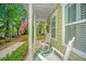Inviting front porch with rocking chairs, providing a cozy spot to relax and enjoy the neighborhood view at 78 Branch Creek Trl, Summerville, SC 29483