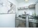 Well-organized laundry room with modern appliances, ample storage, and a sleek design at 78 Branch Creek Trl, Summerville, SC 29483