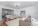 Inviting living room featuring an open layout with an adjacent modern kitchen with wood floors at 78 Branch Creek Trl, Summerville, SC 29483