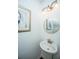 Stylish powder room featuring a pedestal sink, gold accents, and charming decor at 78 Branch Creek Trl, Summerville, SC 29483