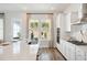 Well-lit kitchen featuring a large island, modern appliances, and a view to the outdoors at 782 Clay Field Trl, Summerville, SC 29485