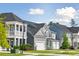 Street view showcasing stylish homes with modern architecture and manicured lawns at 782 Clay Field Trl, Summerville, SC 29485