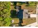 Aerial shot displays a backyard, a trampoline, and green surroundings, and a fenced yard at 8035 Mckayla Rd, Summerville, SC 29483