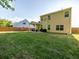 Large backyard with a well-maintained lawn and covered patio at 8035 Mckayla Rd, Summerville, SC 29483