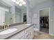Bathroom featuring double sinks, gray quartz countertops, white cabinets, a large mirror and a toilet at 8035 Mckayla Rd, Summerville, SC 29483