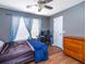 Bedroom featuring hardwood floors, a ceiling fan, a dresser and a desk with a chair at 8035 Mckayla Rd, Summerville, SC 29483