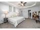 Spacious bedroom with neutral decor, carpet flooring, and a walk-in closet offers comfort and functionality at 8035 Mckayla Rd, Summerville, SC 29483
