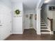 Inviting home foyer with hardwood floors, an elegant staircase, and decorative touches, offers a warm welcome at 8035 Mckayla Rd, Summerville, SC 29483