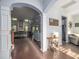 Open-concept living space featuring hardwood floors and tasteful decor, seamlessly connecting living and dining areas at 8035 Mckayla Rd, Summerville, SC 29483