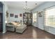 Cozy living room featuring stylish decor, hardwood floors, and lots of natural light creates a relaxing space at 8035 Mckayla Rd, Summerville, SC 29483