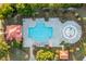 Aerial view features community pool, splash pad, lounge chairs, and tropical palm trees at 8035 Mckayla Rd, Summerville, SC 29483