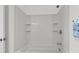 This bathroom has a shower, shower head, and white tile at 822 Rue Dr, Charleston, SC 29414