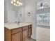 This bathroom features a mirror, sink, and access to the bedroom at 822 Rue Dr, Charleston, SC 29414