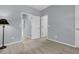 This bedroom features neutral carpet, light blue walls, and a large doorway at 822 Rue Dr, Charleston, SC 29414