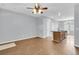 Spacious living room featuring hardwood floors, ceiling fan, and neutral paint at 822 Rue Dr, Charleston, SC 29414