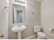 Bathroom featuring a pedestal sink, toilet, and modern fixtures at 8632 Madelyn St, North Charleston, SC 29406