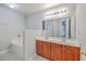 Bathroom featuring double sinks, soaking tub, and updated fixtures at 8632 Madelyn St, North Charleston, SC 29406