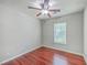 Bedroom with ceiling fan, window, and hardwood floors at 8632 Madelyn St, North Charleston, SC 29406