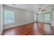 Bright bedroom with natural light, ceiling fan, and wood-look flooring at 8632 Madelyn St, North Charleston, SC 29406