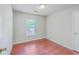 Bedroom featuring a window, wood floor, and neutral paint at 8632 Madelyn St, North Charleston, SC 29406