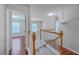 Upstairs hallway with a view to downstairs and into a bedroom at 8632 Madelyn St, North Charleston, SC 29406