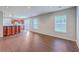 Open living space with hardwood floors, recessed lighting, and access to the kitchen and backyard at 8632 Madelyn St, North Charleston, SC 29406