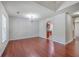 Spacious living room with hardwood floors, a chandelier, and plenty of natural light at 8632 Madelyn St, North Charleston, SC 29406