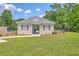 Community pool house with a gray roof, surrounded by a fenced pool area, grass, and lush trees at 8632 Madelyn St, North Charleston, SC 29406
