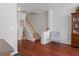 Inviting foyer with hardwood floors, staircase, and stylish decor for a warm welcome at 9206 Southern Oak Ln, Ladson, SC 29456