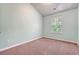 Spacious bedroom with carpet, window with blinds and light teal painted walls at 9418 Sweep Dr, Summerville, SC 29485