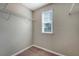Walk-in closet with wire shelving, window, light tan walls and carpet flooring at 9418 Sweep Dr, Summerville, SC 29485