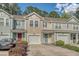 Charming townhomes featuring colorful exteriors, attached garages and well-maintained landscaping enhance curb appeal at 9418 Sweep Dr, Summerville, SC 29485