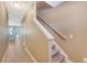 Inviting foyer with neutral walls, carpeted staircase, and wood-look flooring creates a warm welcome at 9418 Sweep Dr, Summerville, SC 29485