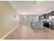 Bright, open kitchen featuring stainless appliances, granite countertops, and a large central island with an eat-in bar at 9418 Sweep Dr, Summerville, SC 29485