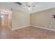 Spacious living room with wood-look flooring, neutral walls, and modern ceiling fan offers a versatile space at 9418 Sweep Dr, Summerville, SC 29485