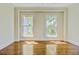 Bright bedroom featuring two large windows and beautiful hardwood flooring throughout at 1 Vendue Range # I, Charleston, SC 29401