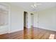 Bedroom with hardwood floors features an ensuite bathroom and multiple closet doors at 1 Vendue Range # I, Charleston, SC 29401