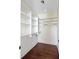 Walk-in closet with shelving and wooden floors, providing ample storage space at 1 Vendue Range # I, Charleston, SC 29401
