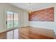 Bright dining room with a chandelier and balcony access at 1 Vendue Range # I, Charleston, SC 29401