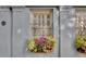 Charming building exterior with window boxes filled with colorful flowers at 1 Vendue Range # I, Charleston, SC 29401