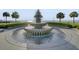 Beautiful pineapple fountain surrounded by palm trees with scenic water views in the background at 1 Vendue Range # I, Charleston, SC 29401