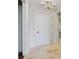 Bright foyer with tiled floors, elegant trim, and a modern chandelier at 1 Vendue Range # I, Charleston, SC 29401