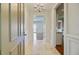 Inviting foyer featuring tile flooring, elegant trim, and a chandelier at 1 Vendue Range # I, Charleston, SC 29401
