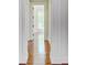Hallway view with gleaming hardwood floors and classic trim at 1 Vendue Range # I, Charleston, SC 29401