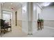Hallway with patterned carpet, decorative trim, chair and table accents, and soft lighting at 1 Vendue Range # I, Charleston, SC 29401