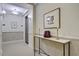 Hallway view featuring an elevator, sconce lighting, artwork, and a decorative table at 1 Vendue Range # I, Charleston, SC 29401