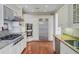 Gourmet kitchen featuring stainless steel appliances, granite countertops, and custom cabinetry at 1 Vendue Range # I, Charleston, SC 29401