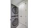 Modern laundry room with a stacked washer and dryer unit at 1 Vendue Range # I, Charleston, SC 29401