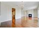 Open floor plan featuring hardwood floors and a fireplace at 1 Vendue Range # I, Charleston, SC 29401