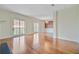 Open living room with hardwood floors, fireplace, and sliding doors to balcony at 1 Vendue Range # I, Charleston, SC 29401